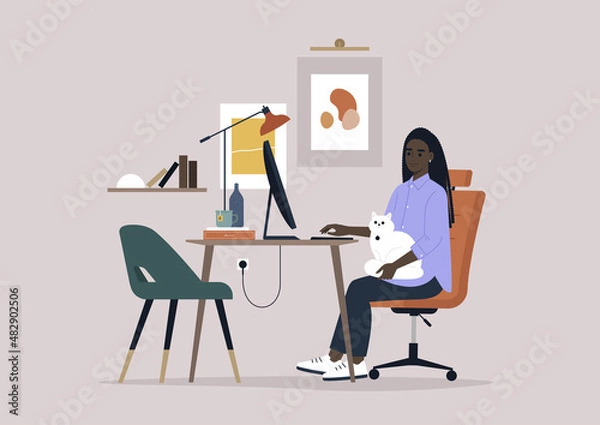 Fototapeta A young millennial character working from home with a cat on their lap, a remote office concept