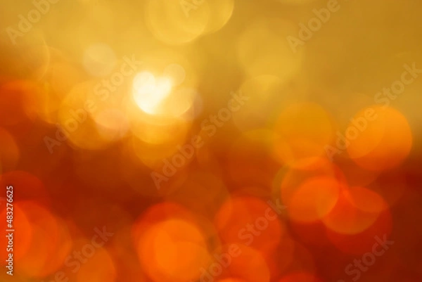 Fototapeta Gold bokeh texture. Festive glitter background with defocused lights