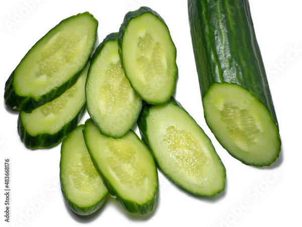 Fototapeta Smooth medium-sized cucumber on a white background. Cucumber slices, isolate. Sliced ​​vegetable.  Green