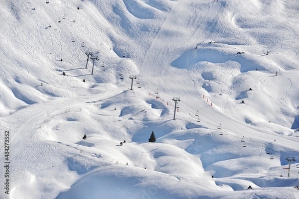 Fototapeta Ski slopes in winter covered with snow on French alps