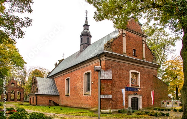 Fototapeta Built in the years 1477-1507 in the Gothic and Neo-Baroque styles, the historic Catholic Church of Our Lady of the Rosary with a belfry in the city of Drobin in Mazovia, Poland.