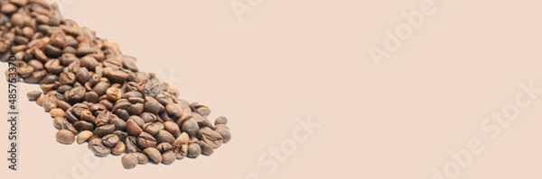 Fototapeta coffee on a light background close-up. concept of making coffee. roasted coffee beans