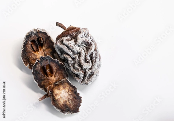 Fototapeta Dried persimmon on a white background. Healthy diet