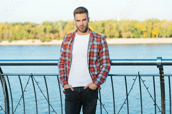 Fototapeta young bearded guy in checkered shirt outdoor, fashion-monger