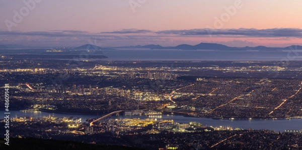 Fototapeta Vancouver Cityscape, British Columbia, Canada on the West Coast of Pacific Ocean. Aerial Panoramic View at Sunset Twilight. Modern City lights. Taken from Grouse Mountain.