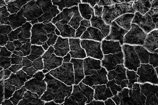 Fototapeta abstract black background with white cracks overlay ground cracked drought, old paint