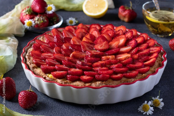 Fototapeta Delicious traditional homemade strawberry pie Crostata on dark background