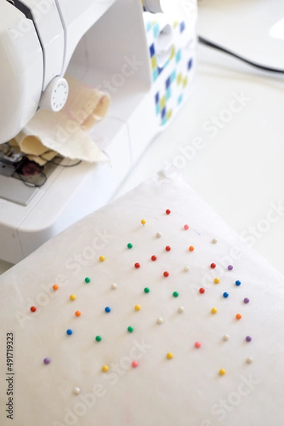 Fototapeta Sewing machine and pin cushion in home interior