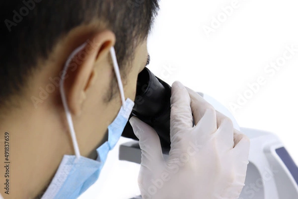 Fototapeta Close up Scientist researcher using microscope in a laboratory
