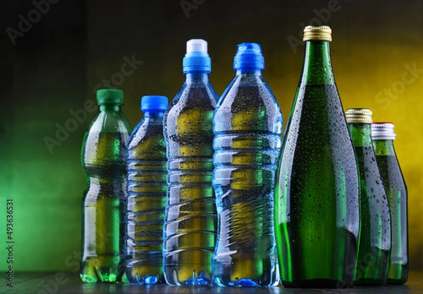 Fototapeta Different sorts of bottles containing mineral water