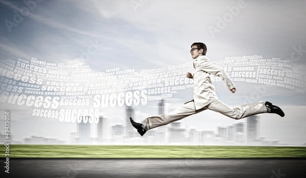 Fototapeta Businessman running on the road