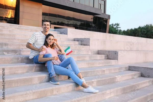 Fototapeta Young couple with Italian flag outdoors