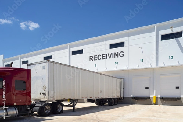 Obraz Distribution warehouse with a truck parked in front of it