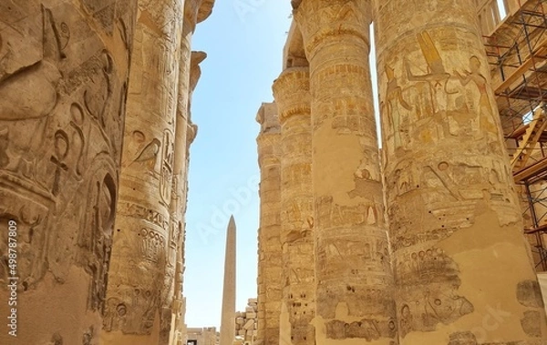 Fototapeta Ancient columns with drawings, in the great hypostyle hall, at the temple of Amon-Re in Karnak, Egypt.