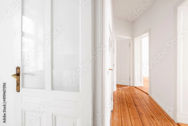 Fototapeta door and corridor in empty flat in renovated old building