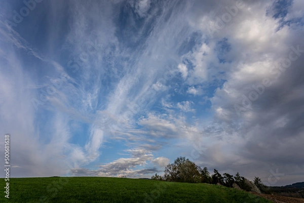 Fototapeta Blue sky and beautiful cloud with meadow and landscape. Simple landscape background for summer posters. Relaxing feeling like in heaven.