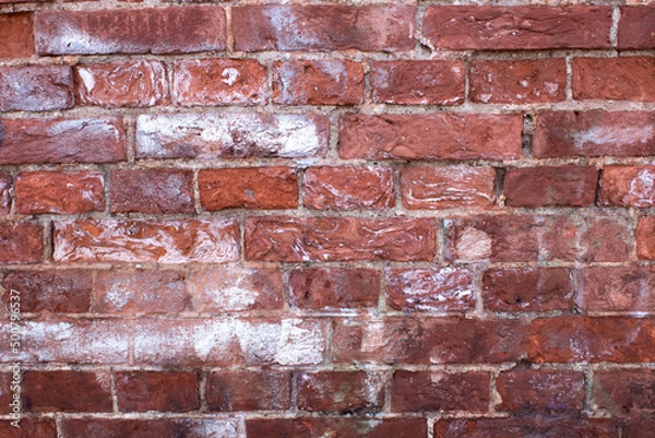 Fototapeta an old red brick wall with streaks