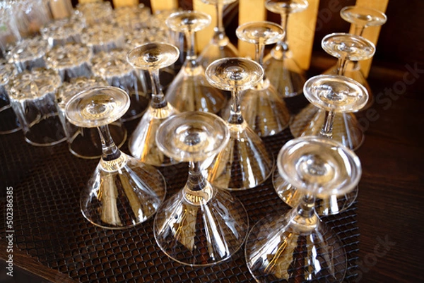 Obraz Empty martini glasses in a row in a bar