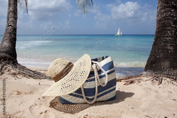 Obraz beach hat and bag on the sand