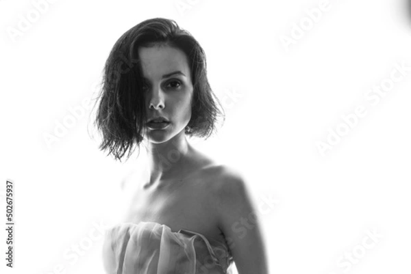 Fototapeta beautiful brunette woman white background, black and white photo