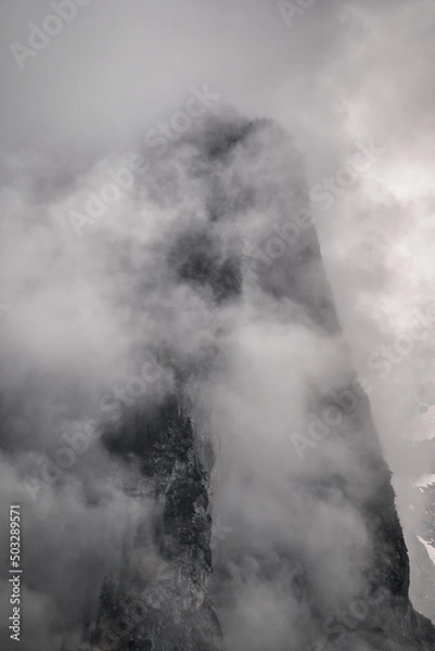 Fototapeta Dramatic fog dark mood in the snow covered mountains - Königssee Alps