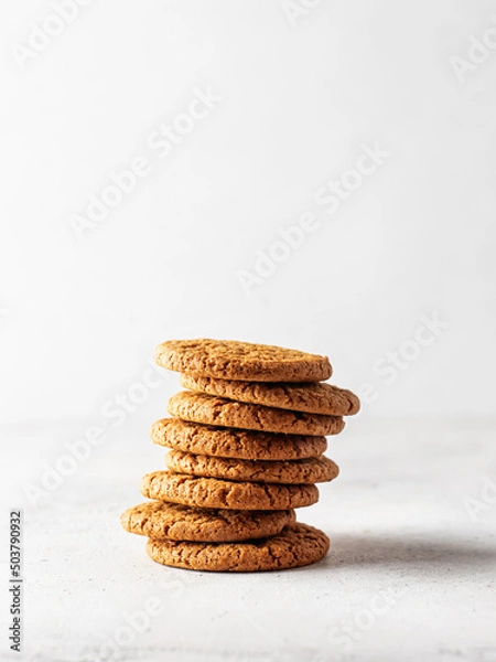 Fototapeta Stack of oatmeal cookies on white background