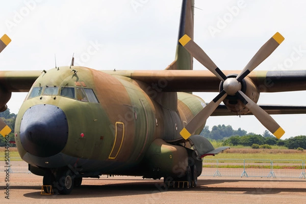 Fototapeta Military Cargo Transport Aircraft Parked At Airport