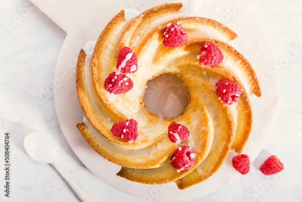 Obraz Cake with raspberries on white board