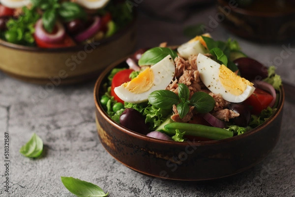 Fototapeta Nicoise salad - traditional French dish