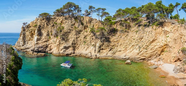 Fototapeta View of secluded cove with emerald green water near Palamos, Catalonia