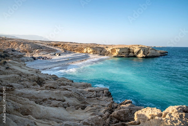 Fototapeta People camping on a beach in the wild coast of the Sultanate of Oman, Middle East, Arabian Peninsula