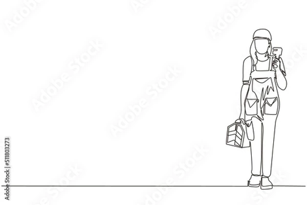 Fototapeta Single one line drawing woman plumber holding wrench and tools box in hands stands isolated. Professional servicewoman character in uniform ready for work. Continuous line draw design graphic vector