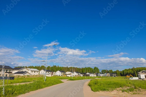 Fototapeta View of construction of modern wooden villas in cottage village. Sweden.