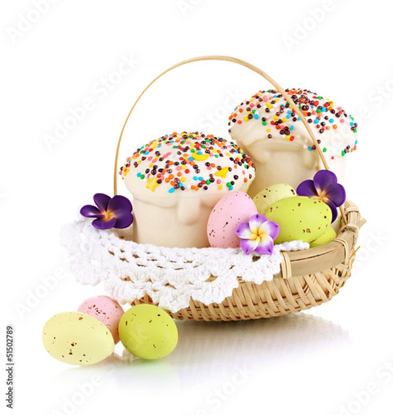 Fototapeta Easter cakes with eggs in wicker basket isolated on white