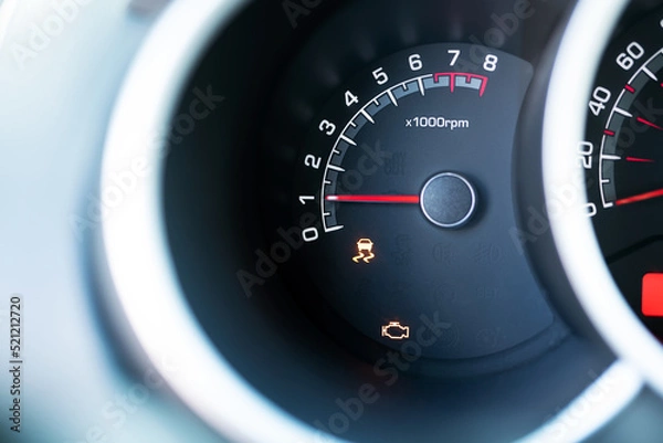 Fototapeta Engine check orange light show on car dashboard. The car need servicing due to engine problem.