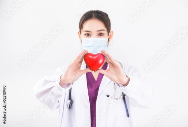 Fototapeta A woman doctor in a white coat