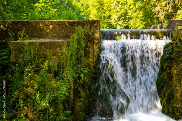 Fototapeta Artificial waterfall at a Hungarian tarn, Josvafo