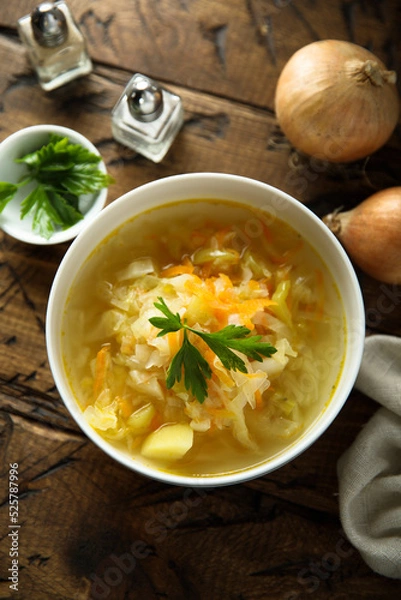 Fototapeta Traditional homemade sauerkraut soup with fresh parsley