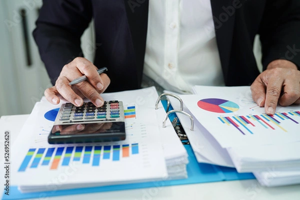 Fototapeta Business woman working and analysis with statistic graph in office.