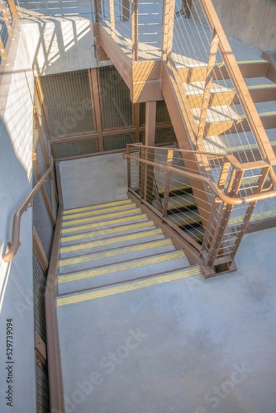 Fototapeta La Jolla, California- High angle view of a staircase with anti-slip strips on each steps