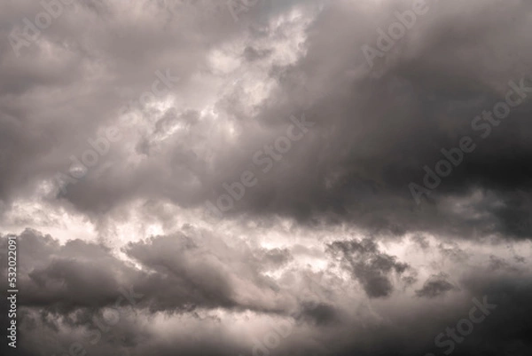 Fototapeta Dark background of storm clouds. Dramatic dark cloudy sky over the sea, natural background photo