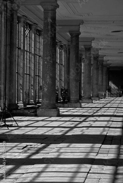 Fototapeta Classic columns, white marble pillars. neoclassical entrance building colonnade. Classic pillars in a row