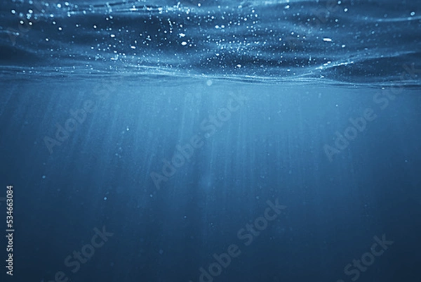 Fototapeta ocean underwater rays of light background, under blue water sunlight