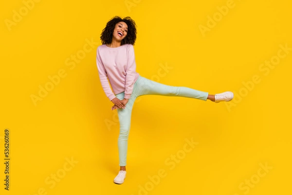 Fototapeta Full body photo of young excited lady have fun dance fooling carefree isolated over yellow color background