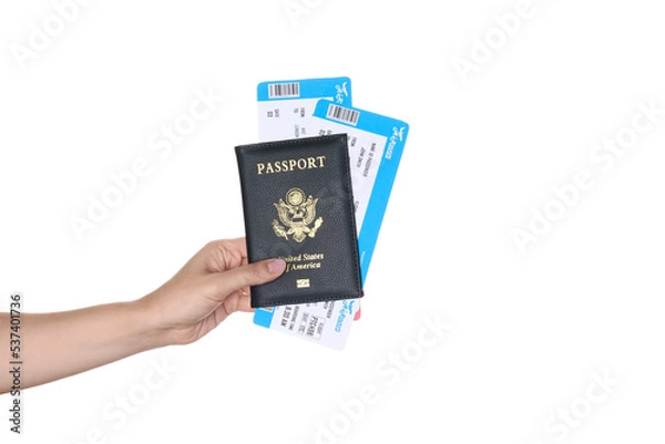 Obraz Woman holding United States passport with tickets isolated on white, closeup