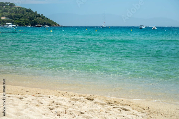 Fototapeta Crystal clear blue water of legendary Pampelonne beach near Saint-Tropez, summer vacation on white sandy beaches of French Riviera, France