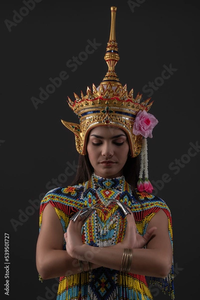 Fototapeta Asian woman in traditional costume of Southern Thailand. Nora dance show.