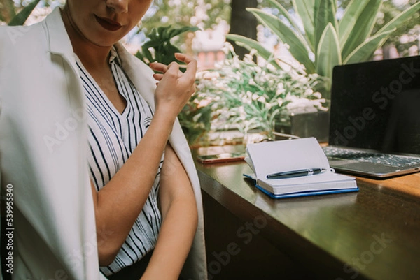 Fototapeta Close up of business woman with white coat