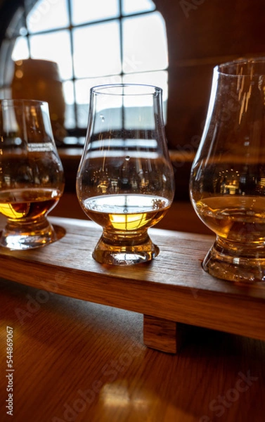 Fototapeta Flight of single malt scotch whisky in glasses served in whiskey bar in Edinburgh, UK