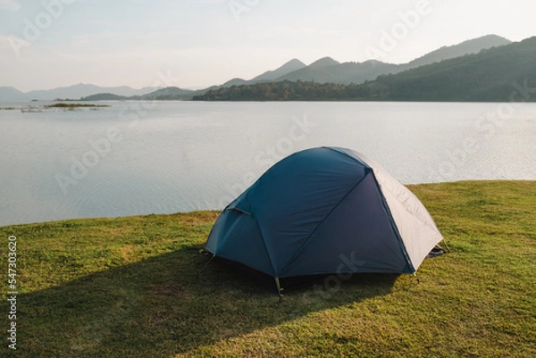 Fototapeta Camping tent in a camping in a forest by the river